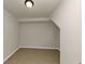 A room with neutral painted walls and tan tile flooring at 2480 Miriam Ln, Decatur, GA 30032
