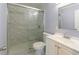 Bathroom with a tiled glass shower and white vanity sink at 2666 Frontier Trl, Atlanta, GA 30341