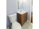 Bathroom features a toilet and vanity with marble-look flooring at 2666 Frontier Trl, Atlanta, GA 30341