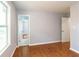Bedroom featuring hardwood flooring and natural light from the window at 2666 Frontier Trl, Atlanta, GA 30341