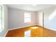 Bedroom with hardwood floors, bright natural light and a white door at 2666 Frontier Trl, Atlanta, GA 30341
