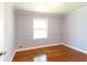 Bedroom features hardwood floors and a bright window at 2666 Frontier Trl, Atlanta, GA 30341
