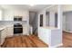Updated kitchen with white cabinets, stainless steel appliances, and an island at 2666 Frontier Trl, Atlanta, GA 30341