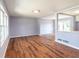 Open-concept living room with modern flooring and ample natural light at 2666 Frontier Trl, Atlanta, GA 30341