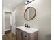 This renovated bathroom features a modern vanity, stylish mirror, and updated fixtures at 3376 Irish Ln, Decatur, GA 30032