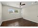 Bright and airy bedroom featuring wood floors and large windows at 3376 Irish Ln, Decatur, GA 30032
