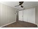 This bedroom features a ceiling fan, wood-look floors, and a closet with double doors at 3376 Irish Ln, Decatur, GA 30032