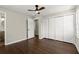 Comfortable bedroom with hardwood floors, ceiling fan, closet, and an en suite bathroom at 3376 Irish Ln, Decatur, GA 30032