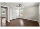 A neutral bedroom with new floors, ceiling fan, and double-door closet offers style and function at 3376 Irish Ln, Decatur, GA 30032