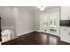 Dining area featuring wood floors, glass doors to outside, and access to the second floor at 3376 Irish Ln, Decatur, GA 30032