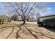 View of the front yard with a mature tree at 3376 Irish Ln, Decatur, GA 30032
