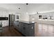 Open-concept kitchen with a center island flows into a spacious living area filled with natural light at 3376 Irish Ln, Decatur, GA 30032