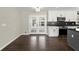 Bright kitchen with white cabinets, stainless steel appliances, and a charming outdoor view from the glass doors at 3376 Irish Ln, Decatur, GA 30032