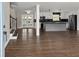 Open-concept design with a modern kitchen, stainless steel appliances, and staircase at 3376 Irish Ln, Decatur, GA 30032