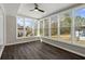 Inviting sunroom filled with natural light from large windows overlooking the backyard at 3376 Irish Ln, Decatur, GA 30032