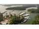 An aerial view of Lake Lanier, showing multiple covered boat docks and lush green trees surrounding the lake at 653 Summit Hill Way, Cumming, GA 30040