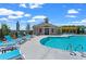 Relaxing community pool with comfortable lounge chairs and a clubhouse view at 653 Summit Hill Way, Cumming, GA 30040
