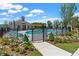 Inviting community pool area with a lounge, pergola, and lush landscaping at 653 Summit Hill Way, Cumming, GA 30040
