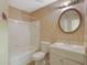 Functional bathroom with a white vanity, sink, and combination tub and shower at 1045 Forest Path, Stone Mountain, GA 30088