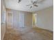 Large bedroom with carpet and neutral walls, with view through to bathroom at 1045 Forest Path, Stone Mountain, GA 30088