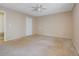 Spacious bedroom featuring carpet floors, neutral paint, and a door to the hallway at 1045 Forest Path, Stone Mountain, GA 30088
