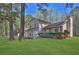A serene exterior view of a two-story home with a lush front lawn at 1045 Forest Path, Stone Mountain, GA 30088