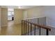 Hallway view with stairs and railing leading to the kitchen at 1045 Forest Path, Stone Mountain, GA 30088