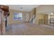 Inviting living room featuring a stone fireplace, staircase, and natural light at 1045 Forest Path, Stone Mountain, GA 30088