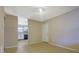 The living room offers a view into the kitchen, with vinyl floors and neutral walls at 1045 Forest Path, Stone Mountain, GA 30088
