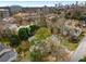 An aerial view shows the property in a residential neighborhood with the city skyline in the background at 1109 Pine Grove Ne Ave, Brookhaven, GA 30319