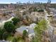 An aerial view shows the property in a residential neighborhood with the city skyline in the background at 1109 Pine Grove Ne Ave, Brookhaven, GA 30319