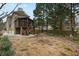 Expansive backyard featuring a raised screened porch, manicured landscaping, and stone retaining walls at 1109 Pine Grove Ne Ave, Brookhaven, GA 30319