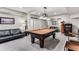 Finished basement features a dark pool table, neutral colors and ample seating at 1109 Pine Grove Ne Ave, Brookhaven, GA 30319