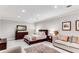 Bedroom boasts a seating area, neutral tones, and large area rug at 1109 Pine Grove Ne Ave, Brookhaven, GA 30319