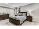 Spacious bedroom featuring a dark wood furniture set, and neutral gray walls and carpet at 1109 Pine Grove Ne Ave, Brookhaven, GA 30319
