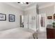 Cozy bedroom with neutral walls, ceiling fan, and convenient access to an ensuite bathroom at 1109 Pine Grove Ne Ave, Brookhaven, GA 30319