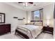 Well-lit bedroom with a trey ceiling, neutral colors, and a ceiling fan at 1109 Pine Grove Ne Ave, Brookhaven, GA 30319