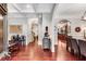 Grand foyer with hardwood floors, detailed millwork, and open sightlines into other living spaces at 1109 Pine Grove Ne Ave, Brookhaven, GA 30319