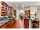 Gourmet kitchen with dark wood cabinets, an island, and stainless steel appliances at 1109 Pine Grove Ne Ave, Brookhaven, GA 30319