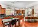 Large kitchen with dark wood cabinets, granite countertops, an island, and wood floors at 1109 Pine Grove Ne Ave, Brookhaven, GA 30319
