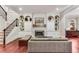 Inviting living area featuring a fireplace flanked by custom built-ins and hardwood floors at 1109 Pine Grove Ne Ave, Brookhaven, GA 30319