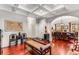 Open-concept living space with hardwood floors, coffered ceilings, and seamless flow into dining area at 1109 Pine Grove Ne Ave, Brookhaven, GA 30319
