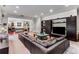 Open-concept living room with a large sofa and view of the foyer and dining area at 1109 Pine Grove Ne Ave, Brookhaven, GA 30319