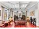 Elegant living room with coffered ceiling, hardwood floors, and custom window treatments at 1109 Pine Grove Ne Ave, Brookhaven, GA 30319