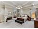 Spacious main bedroom features a tray ceiling, fireplace, sitting area, and natural light at 1109 Pine Grove Ne Ave, Brookhaven, GA 30319