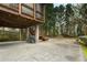 The concrete patio is located under the screened in porch, next to stone landscaping at 1109 Pine Grove Ne Ave, Brookhaven, GA 30319
