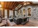 Inviting screened porch featuring a wood ceiling, brick accents, and comfortable seating arrangements at 1109 Pine Grove Ne Ave, Brookhaven, GA 30319