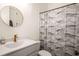 Clean bathroom features vanity, oval mirror, and shower with decorative curtain at 120 Beardon Se Cir # 2, Atlanta, GA 30316