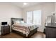 Cozy bedroom with wood flooring, dresser, and natural light from the bright window at 120 Beardon Se Cir # 2, Atlanta, GA 30316