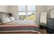 Comfortable bedroom showcasing a bed with stylish linens, wood flooring, and natural light at 120 Beardon Se Cir # 2, Atlanta, GA 30316